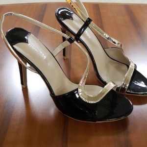 Black and gold pumps